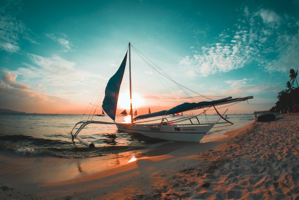 white boat docked on seashore